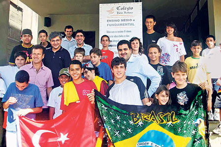 Brazil coach Dunga (2nd L, in purple shirt) at a Turkish school in Sao Paulo