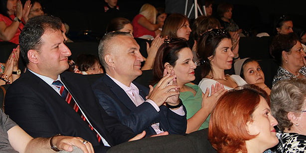Albanian Speaker of Parliament Ilir Meta (2nd L) watching a show performed by students of Turgut Özal College in Tiran with the show's director, Hüseyin Yavuz (L), on Friday. (Photo: Cihan)