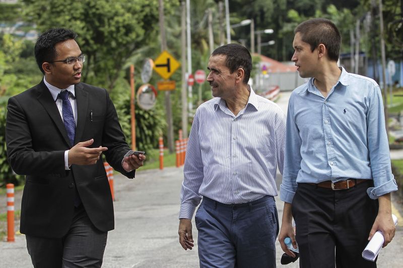 Ismet Ozcelik (centre) and his son Suheyl Ozcelik are seen with lawyer Muhammad Faizal Faiz Mohd Hasani (left) outside the United Nations High Commission for Refugees (UNHCR) building in Kuala Lumpur January 31, 2017. ― Picture by Yusof Mat Isa