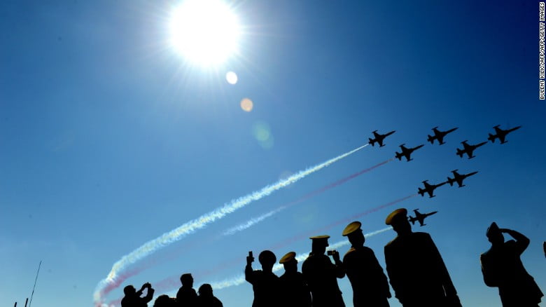 Turkish air force patrollers fly by as soldiers watch during a ceremony in April 2011.