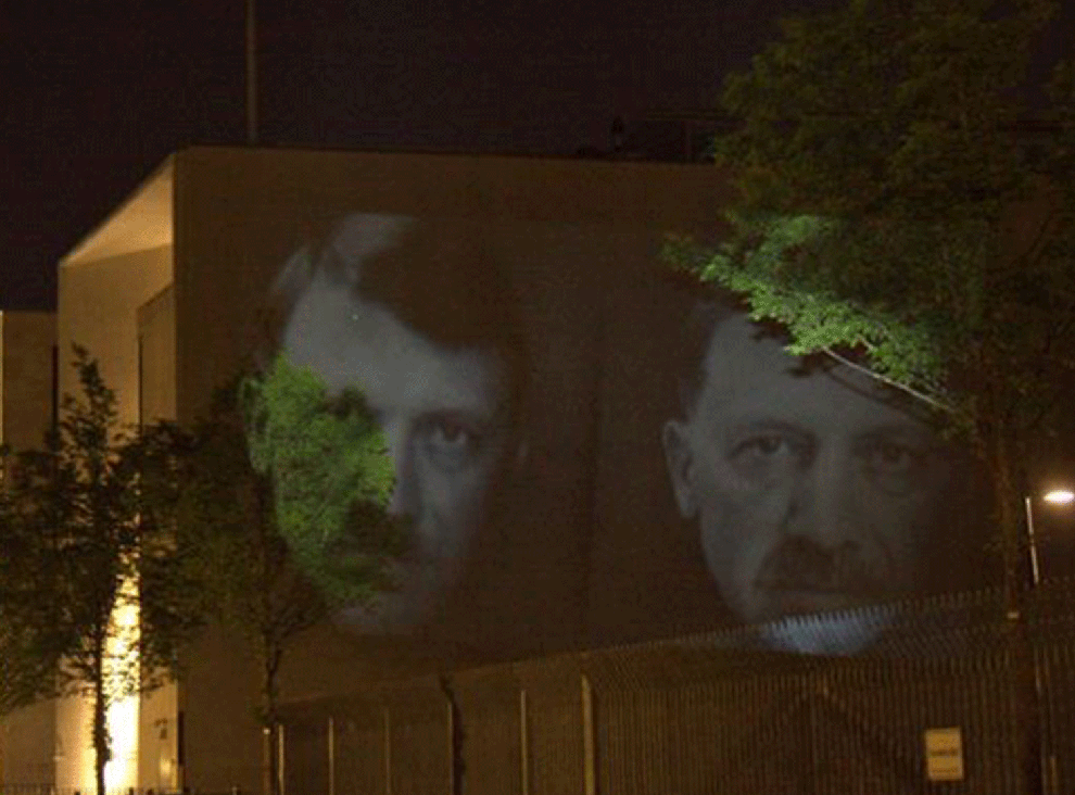 Turkish president Erdogan's face is projected alongside Nazi leader Adolf Hitler in Berlin (PixelHelper/Facebook)